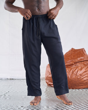 Close-up of loose black drawstring trousers from the Lounge Black men's lounge set